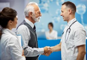 old patient meeting with doctor for Annual Wellness Visit